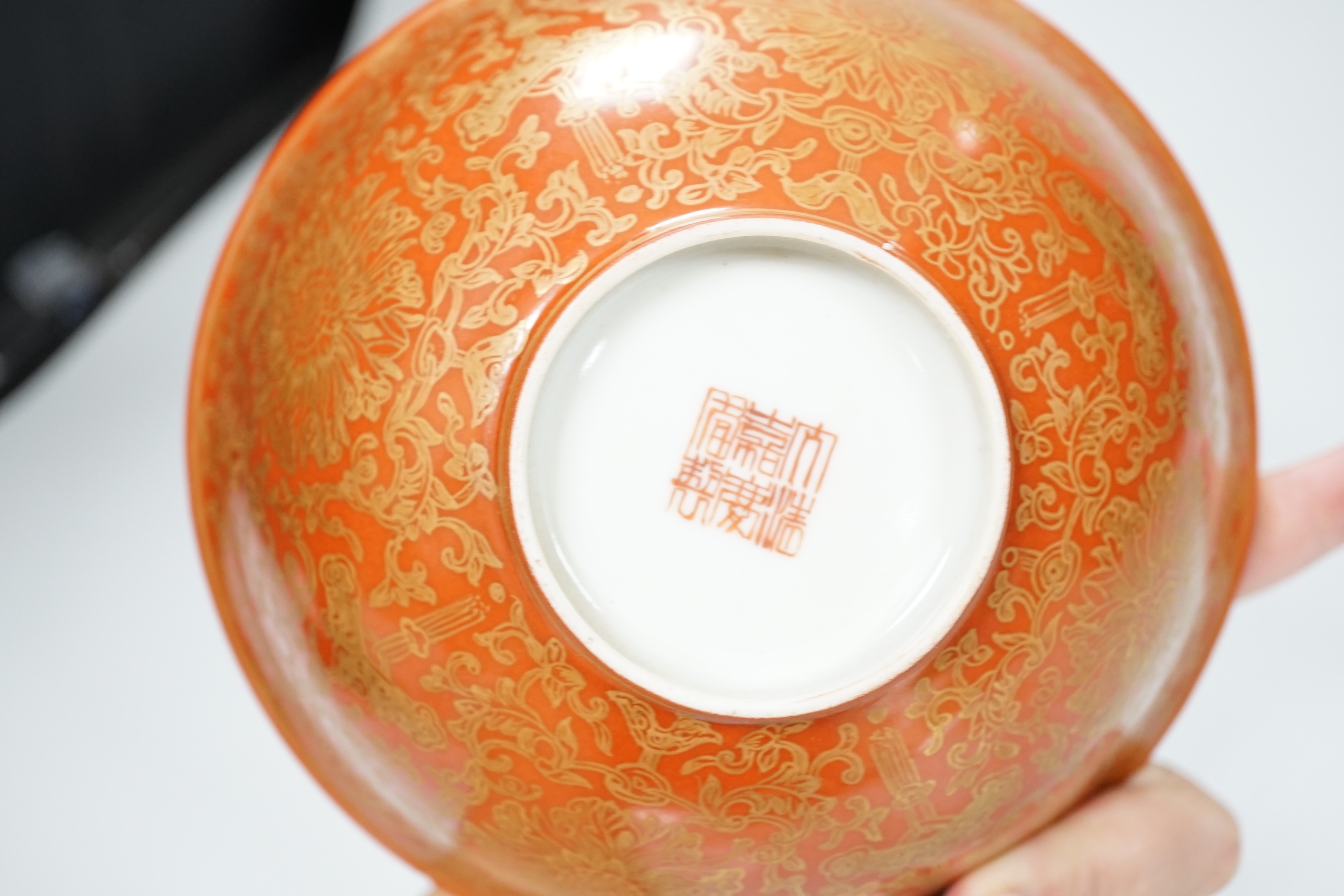 A Chinese gilded coral-ground bowl, 17cm diameter